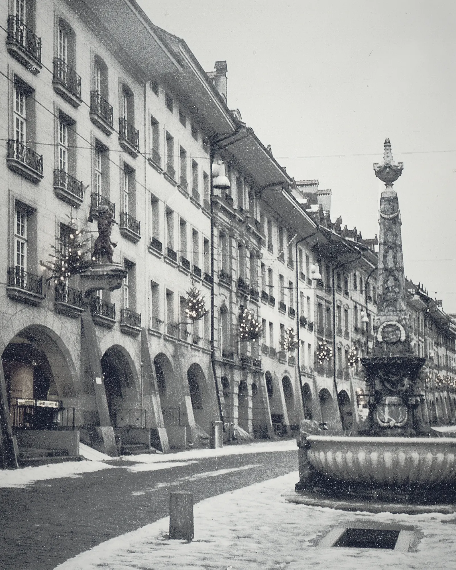Stone arcades along a street in the old town of Bern
